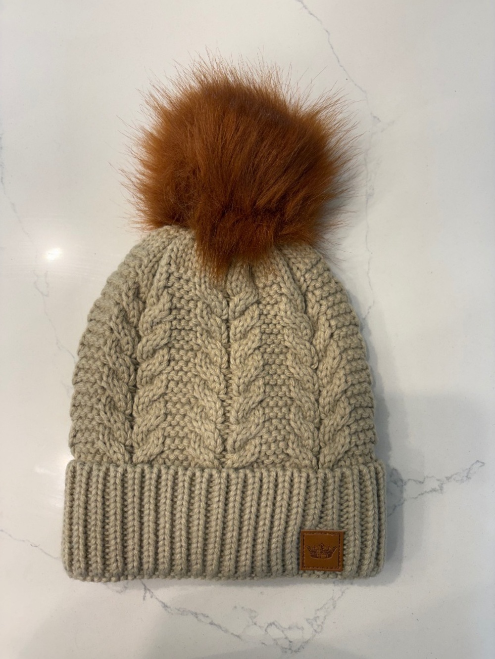 Panache Beige cable knit hat with Bronze  pom